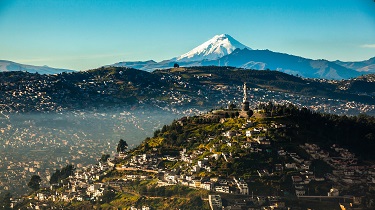 View of El Panecillo in the centre of Quito, Ecuador with the Cotopaxi in the background