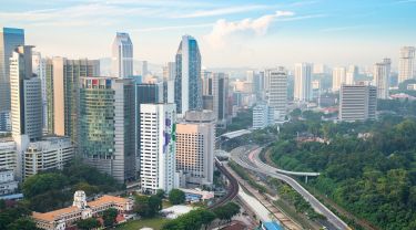 Cityscape view of Kuala Lumpur, Malaysia at sunrise.