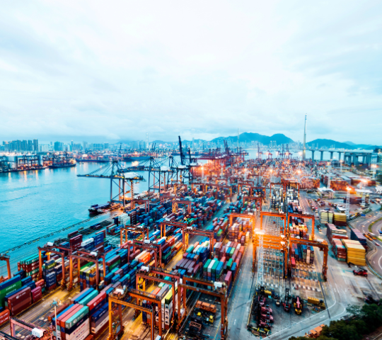 Shipping yard with containers at dusk.