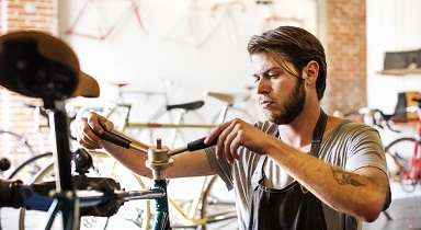 A person fixing a bicycle