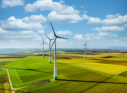 Aerial drone view of wind turbines.