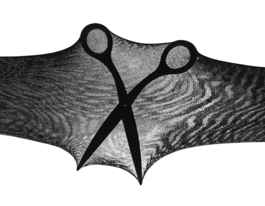 A pair of scissors open inside SRTX tights to demonstrate the rip-resistent technology.