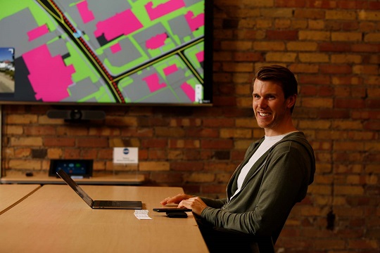 Jon Lipinski, president of Ecopia, sitting at his desk