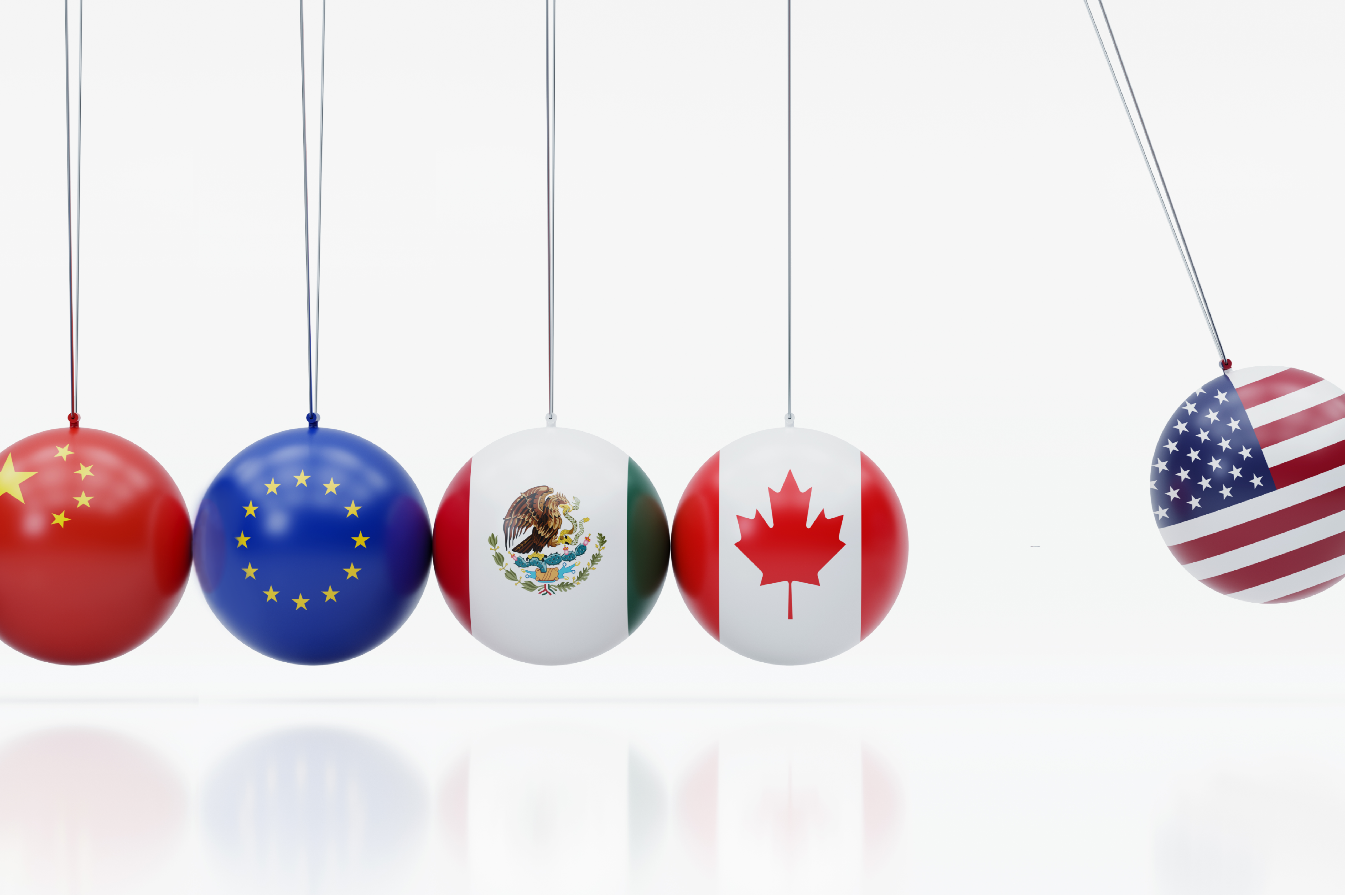 Newton’s cradle features dangling metal balls covered in the American, Canadian, Mexican, Chinese and European Union flags.
