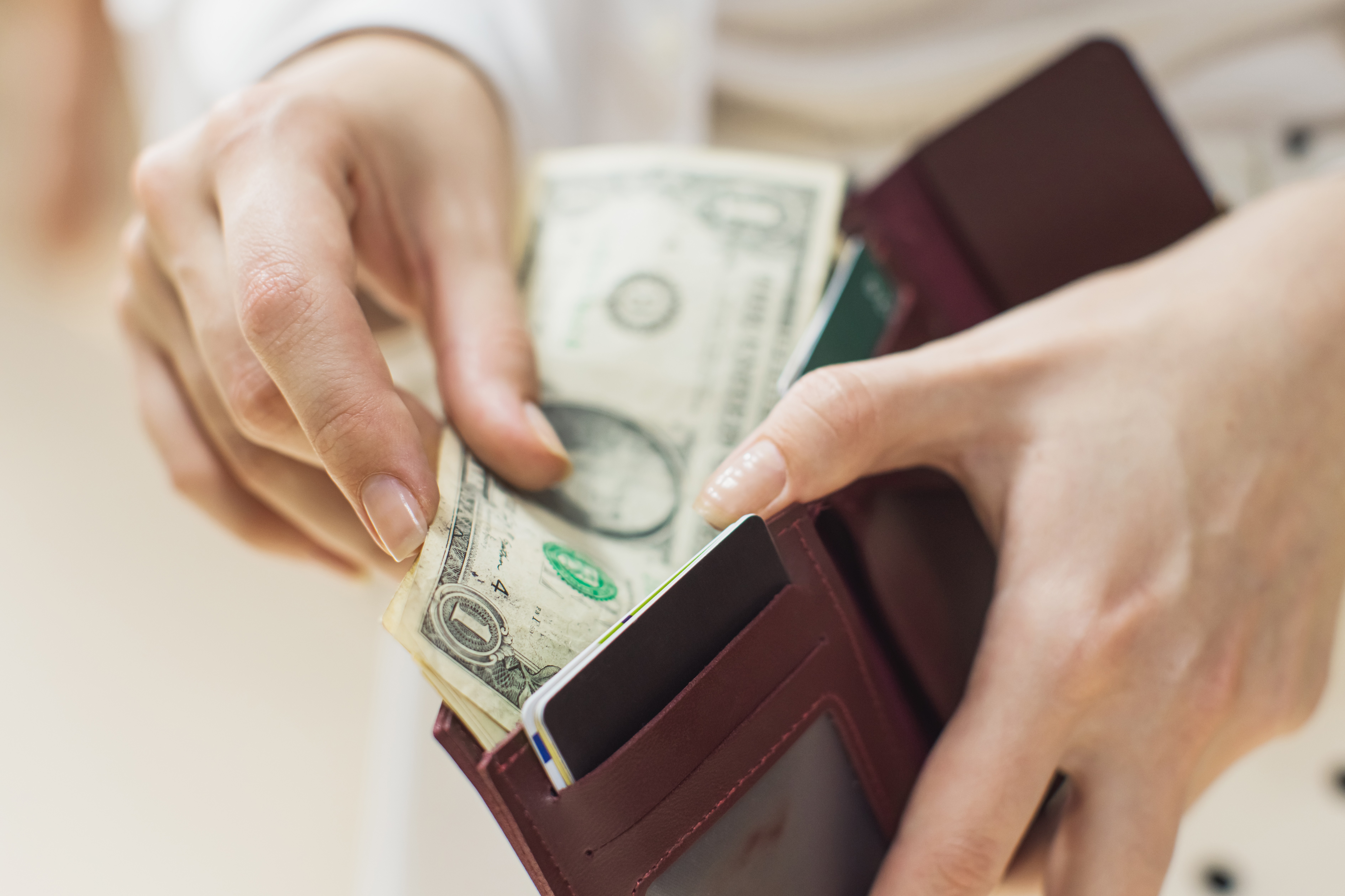 Close-up of a one-dollar bill inside a wallet, symbolizing personal finance and economic value.