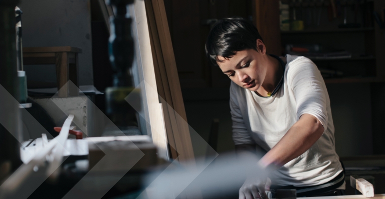 Female carpenter working in workshop