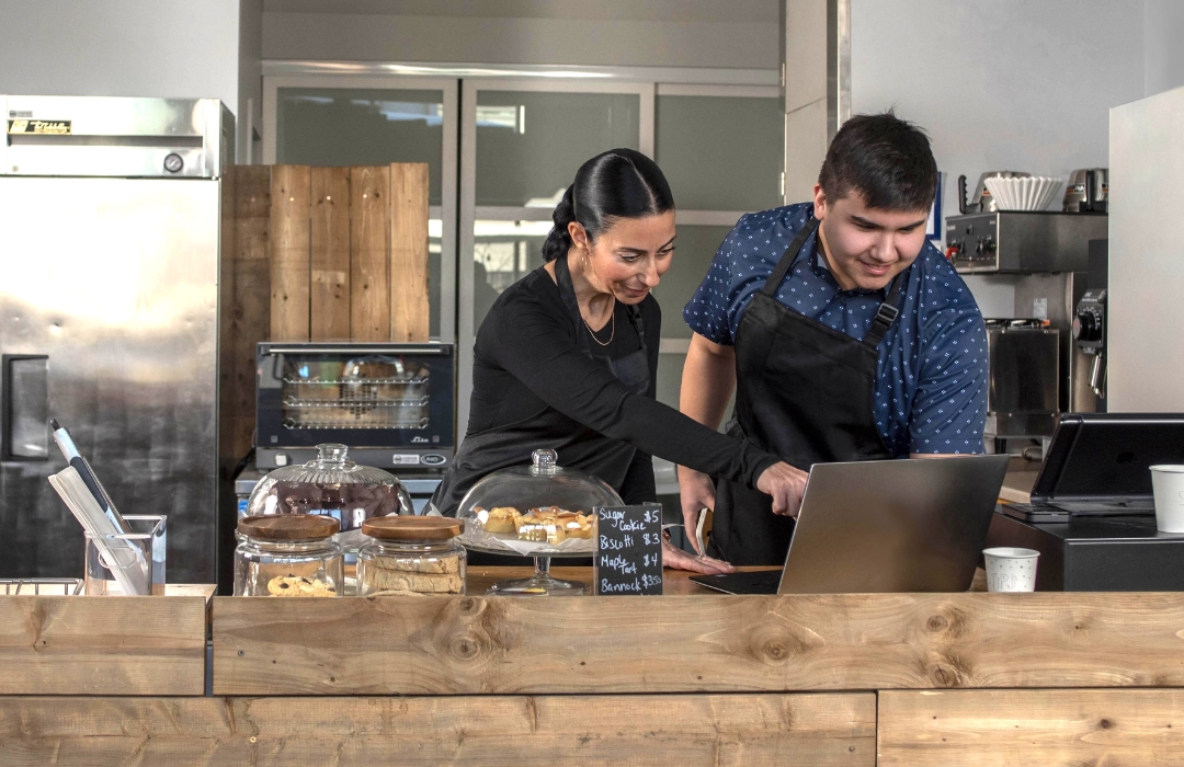 Two Indigenous employees in a cafeteria