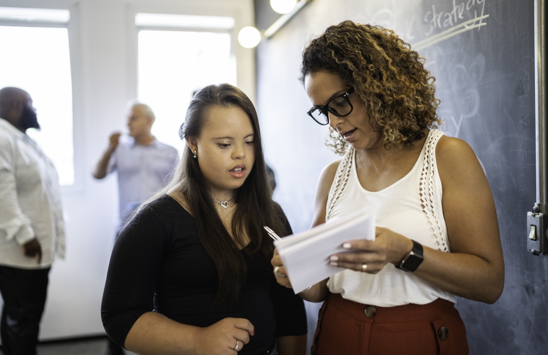 Employee mentors an employee with a disability