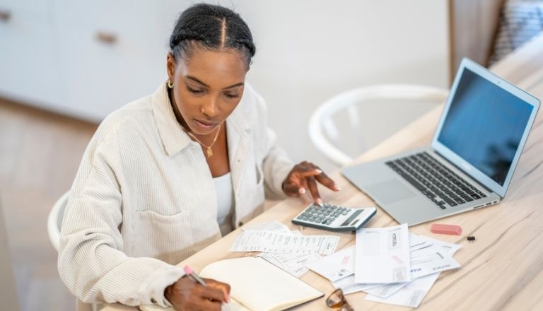 Business owner reviewing finances and cash flow needs.