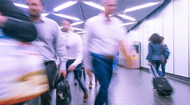 People rushing through an airport