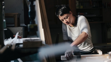 Female carpenter working in workshop