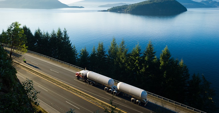 A fuel truck driving down a highway