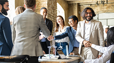 A group of people shaking hands