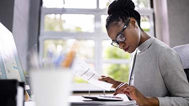 Woman working on business reports