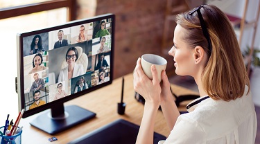 Woman networking with other business people on an Zoom call.