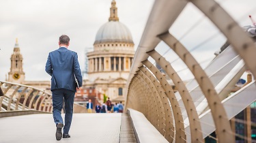 Canadian businessman walks to a meeting in a European capital.