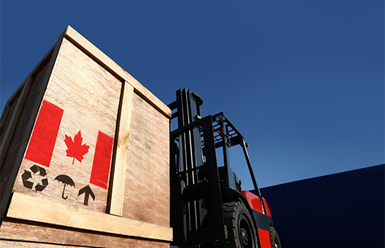 Wooden container with the Canadian flag logo being exported on a truck