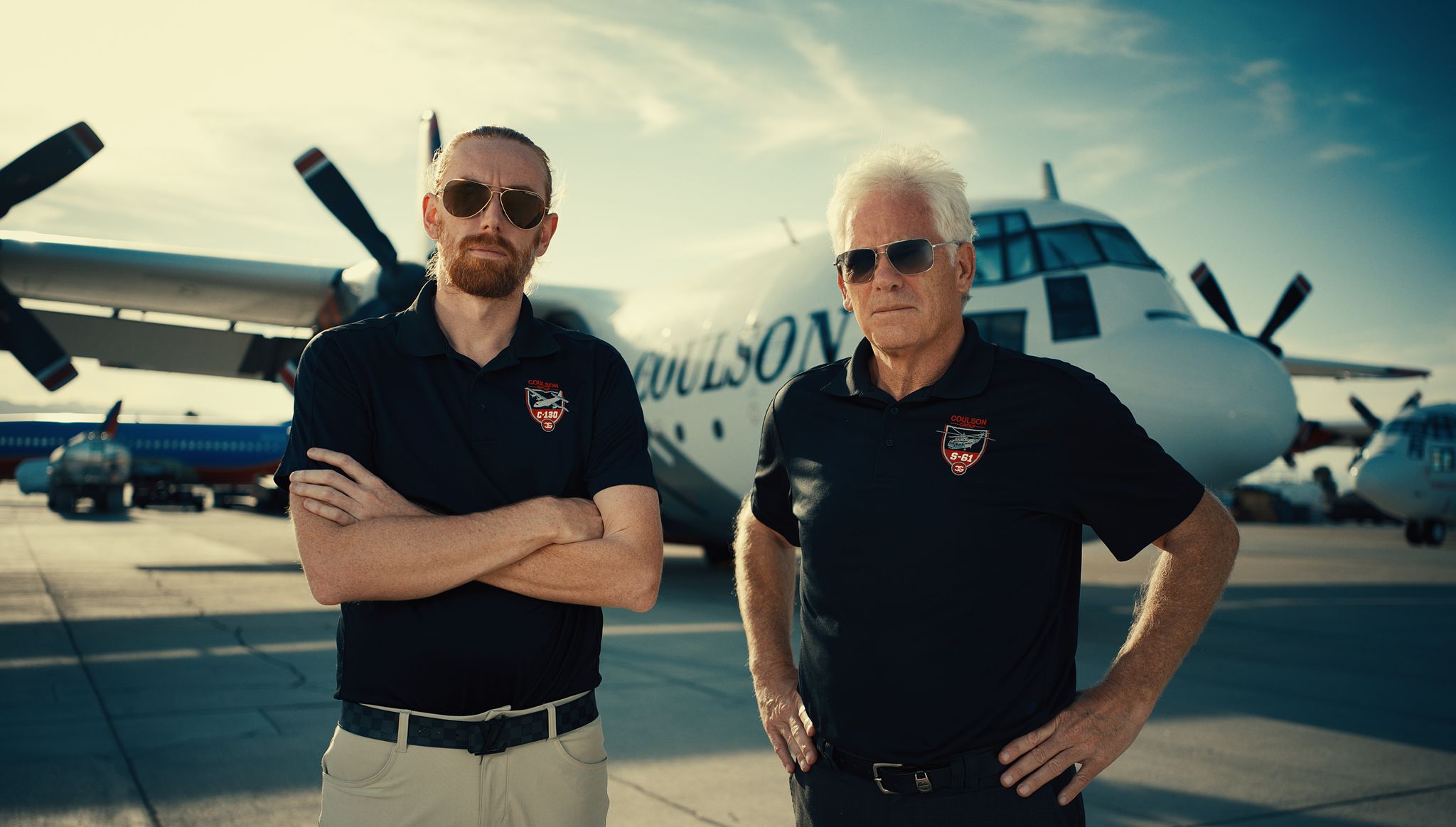 Wayne Coulson and his son Britt Coulson standing in front of a Coulson Aviation aircraft