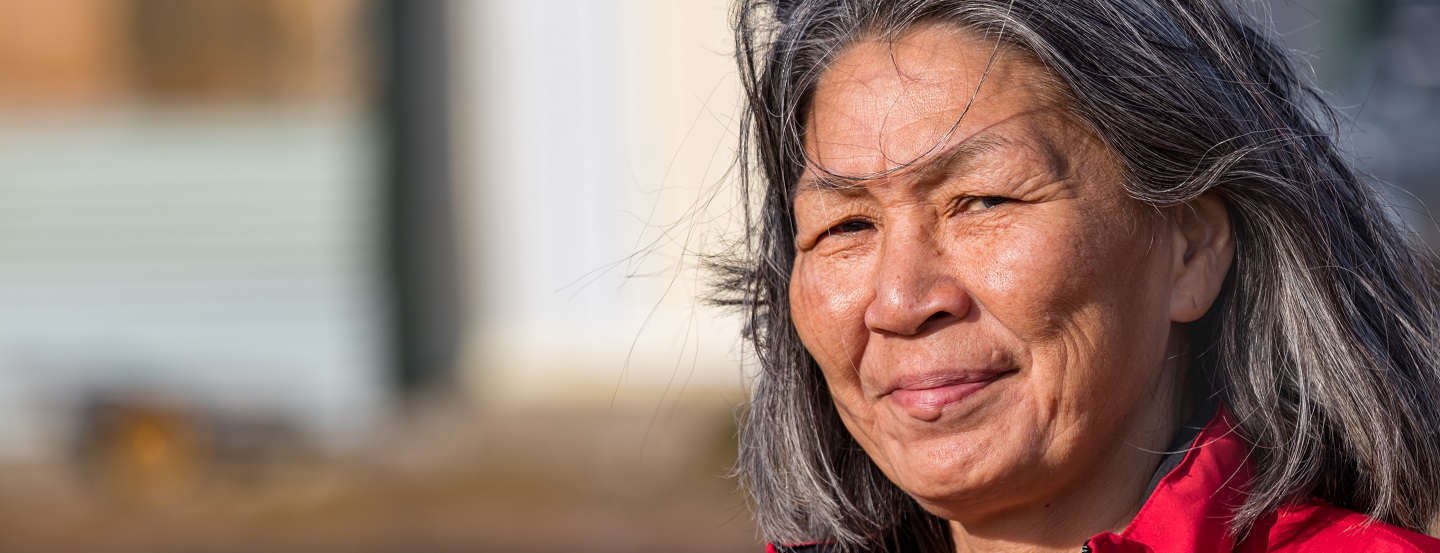 Indigenous woman looking into the wind