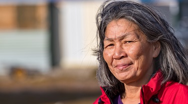 Indigenous woman looking into the wind