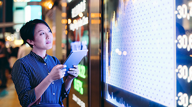 Person viewing financial graph on computer that suggests fluctuating currencies.