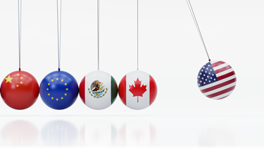 Newton’s cradle features dangling metal balls covered in the American, Canadian, Mexican, Chinese and European Union flags.