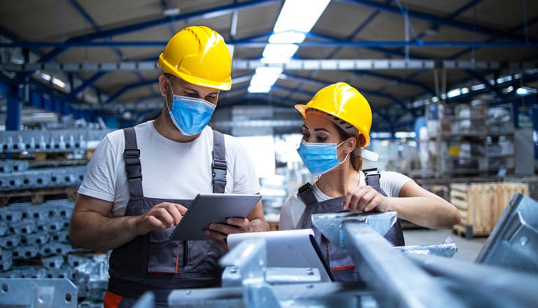 Passenger sits alone in darkly lit airport