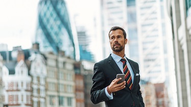 Handsome Canadian exporter walks to meeting in London.