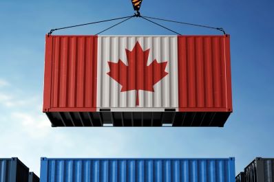 Canada trade cargo container hanging against clouds background
